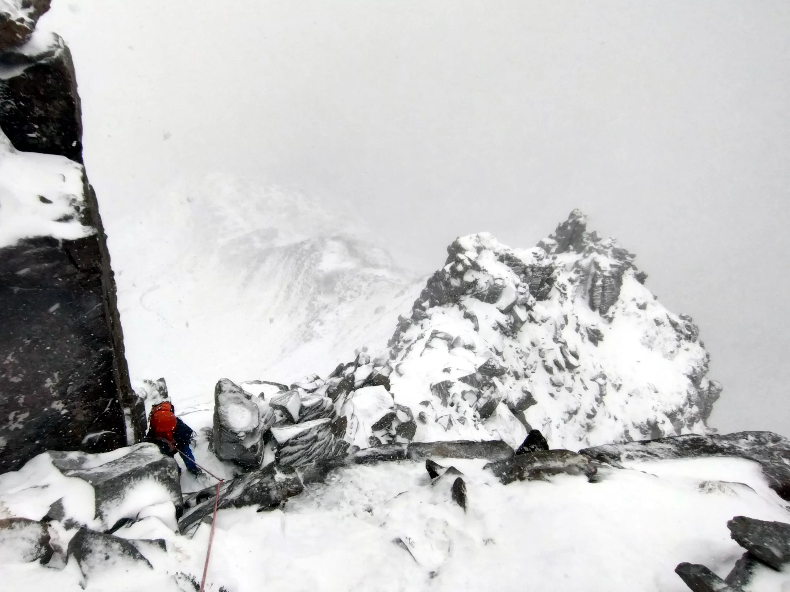 winter mountaineer in a snowstorm on Liathach