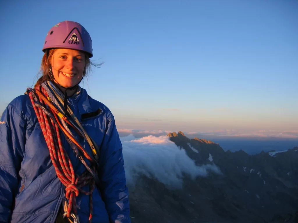 photo of Sarah on the summit at sunset
