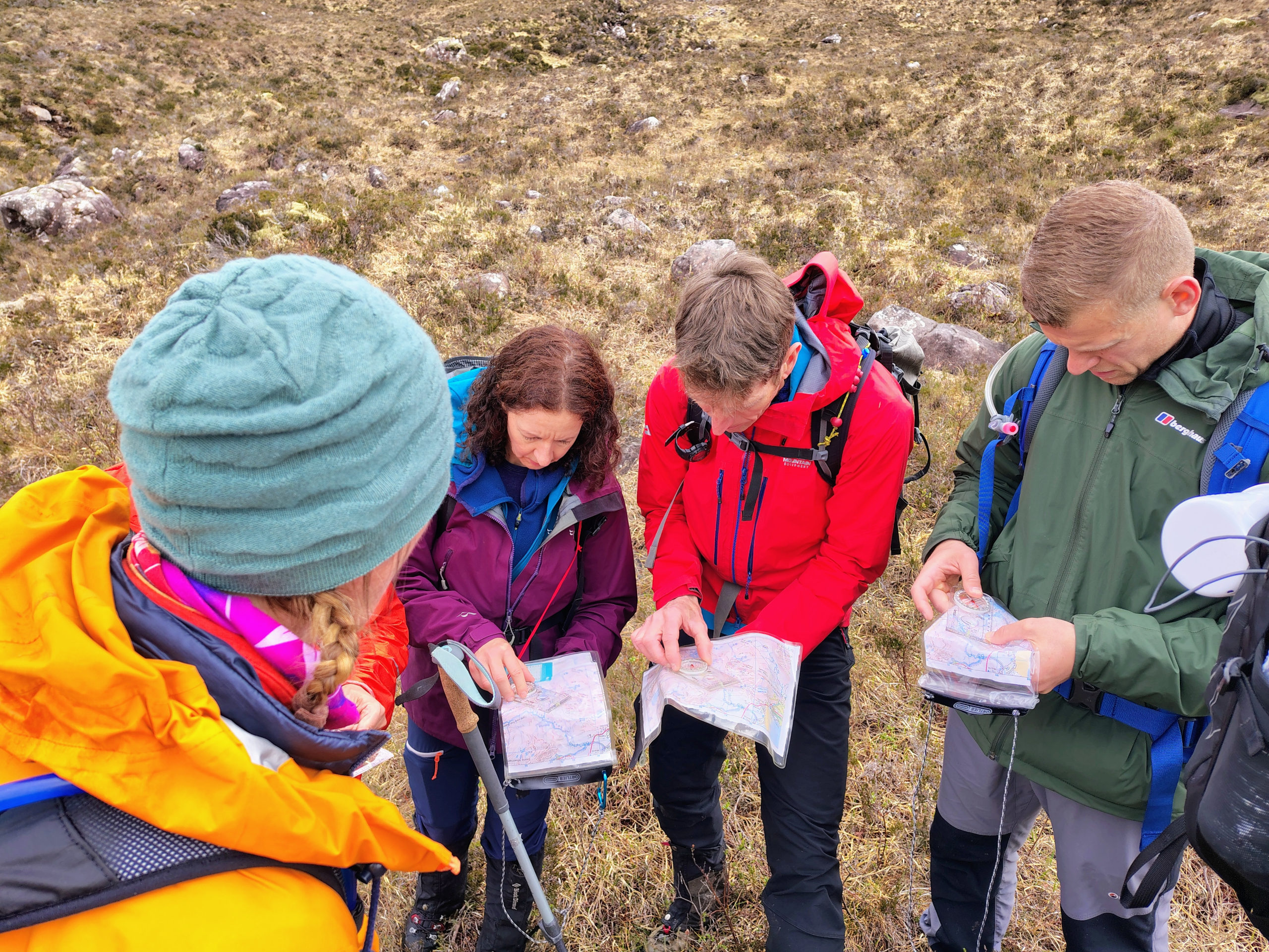 Photo of a group learning to use a compass on a Mountain Leader Training Course